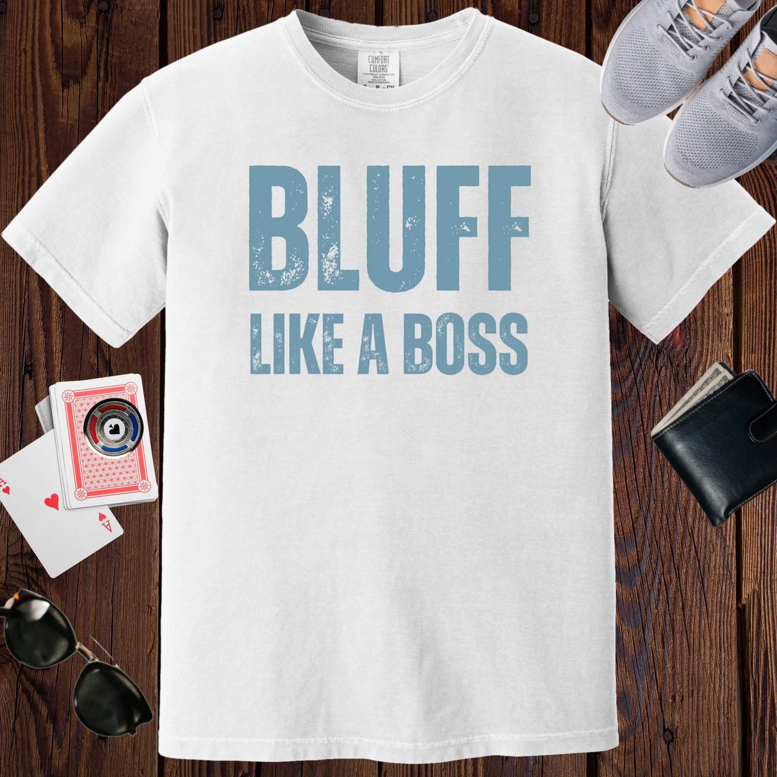 White colored unisex crewneck poker-themed T-shirt. Design features the text 'Bluff like a boss'.