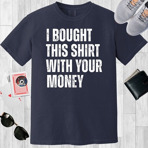 Navy colored unisex crewneck poker-themed T-shirt. Design features the text 'I bought this shirt with your money'.