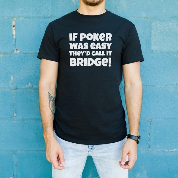 Young man wearing a black t-shirt with the text 'If poker was easy they'd call it bridge!'