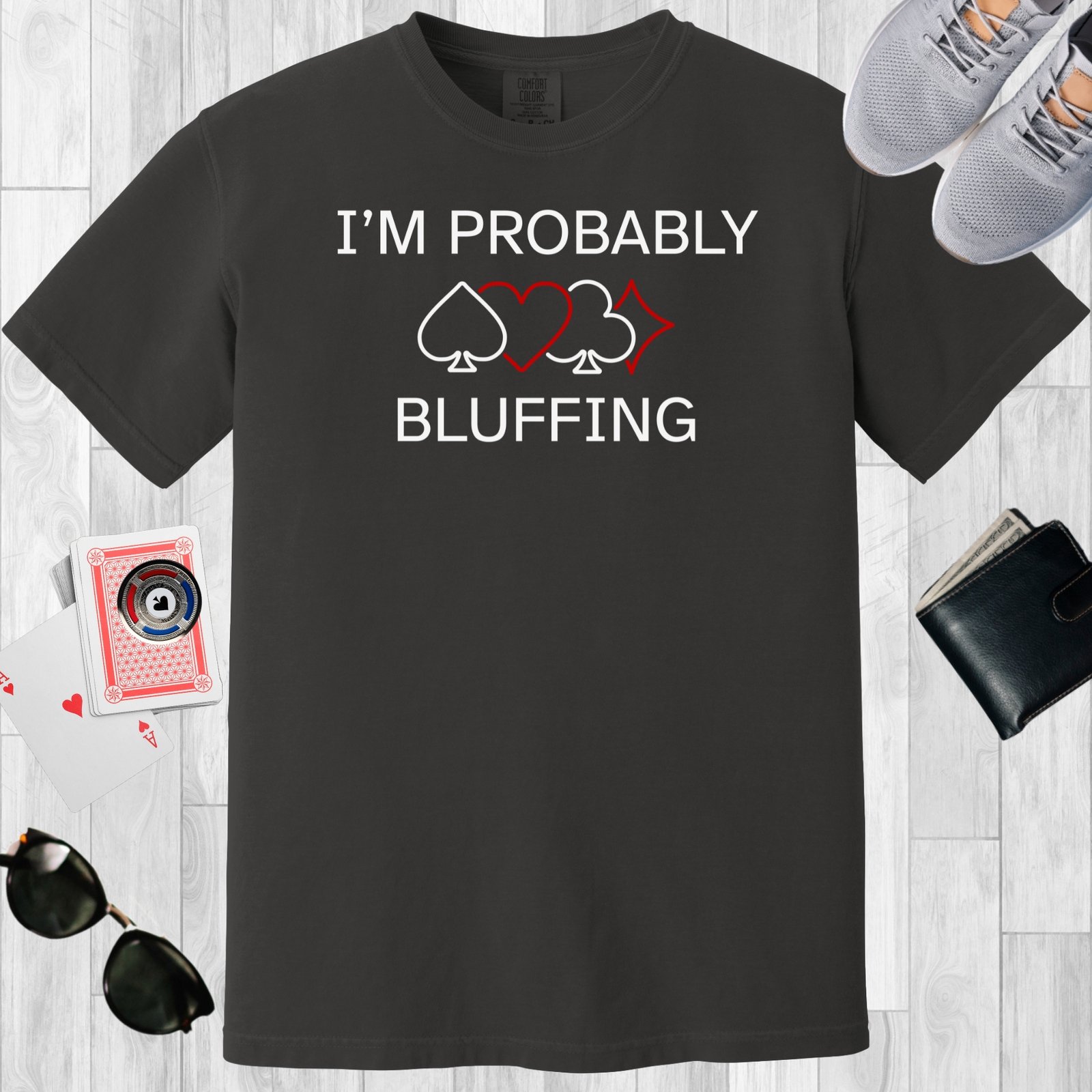 Graphite colored unisex crewneck poker-themed T-shirt. Design features line art of card suits and the text 'I'm probably bluffing'.