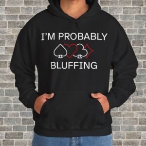 Person wearing a black poker-themed Gildan hooded sweatshirt with the text "I'm probably bluffing" in front of a brick wall.