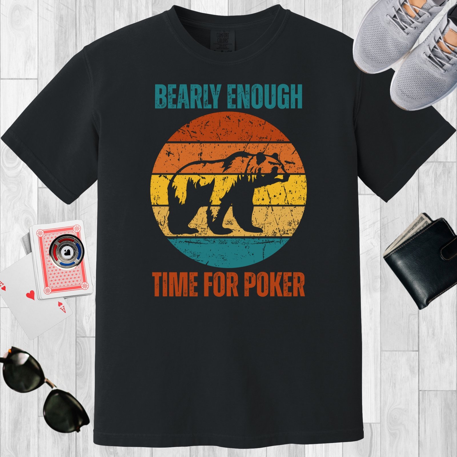 Black colored unisex crewneck poker-themed T-shirt. Design features the text 'Bearly enough time for poker'. Image of a grizzly bear on a retro sunset background.