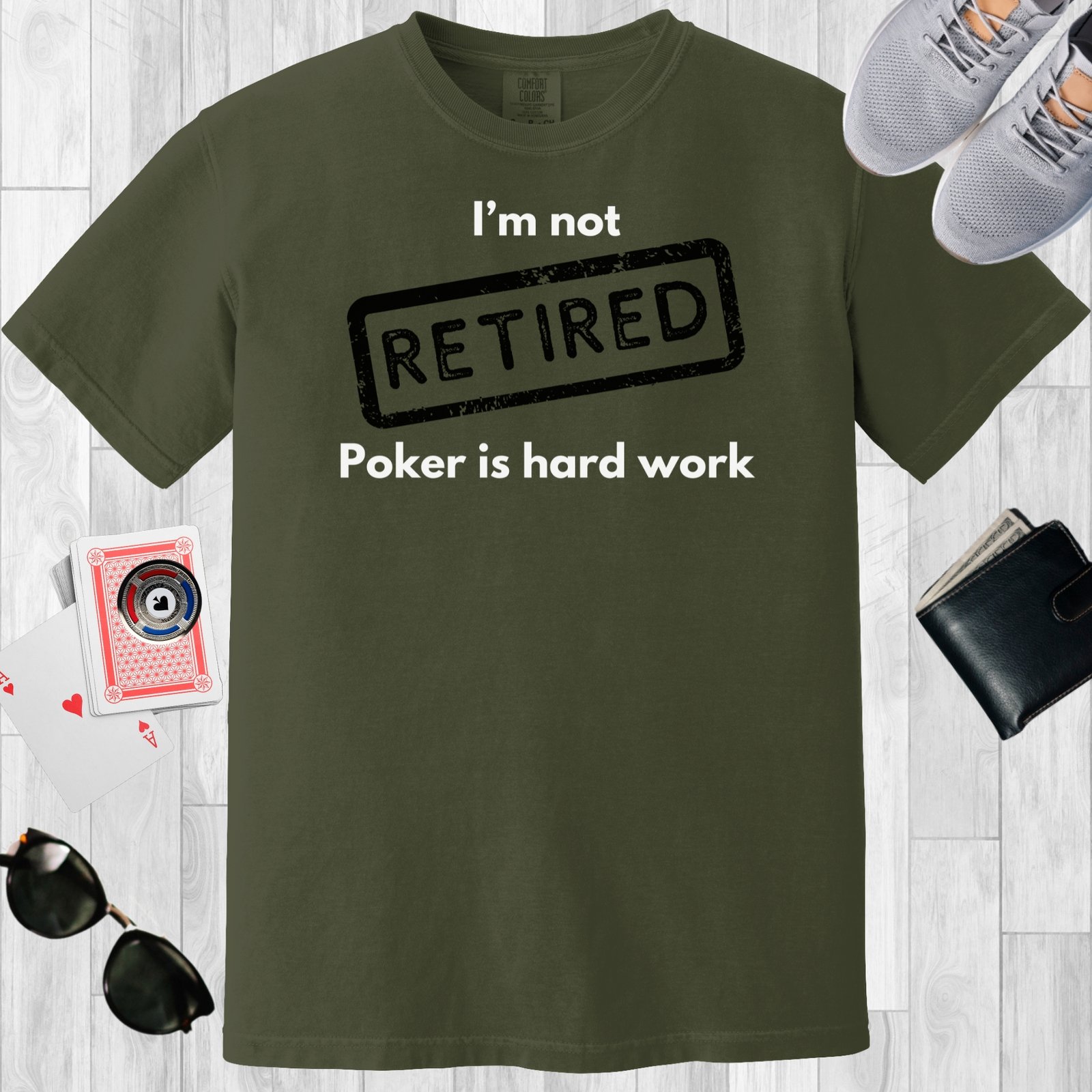 Moss colored unisex crewneck poker-themed T-shirt. Design features the text 'I'm not retired, poker is hard work'.