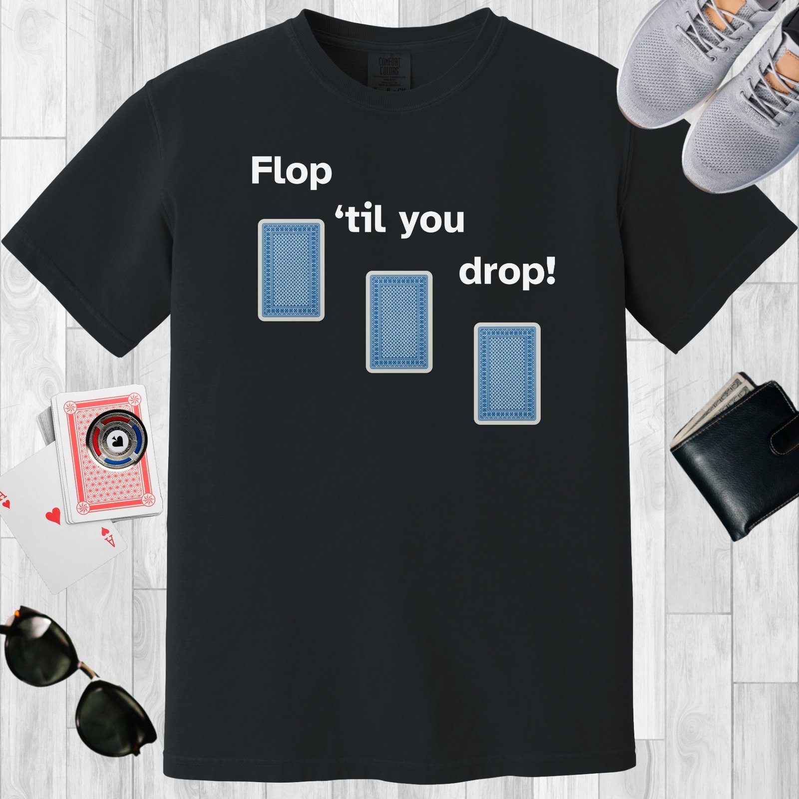 Black colored unisex crewneck poker-themed T-shirt. Design features the text 'Flop 'til you drop'. Image of 3 playing cards face down.