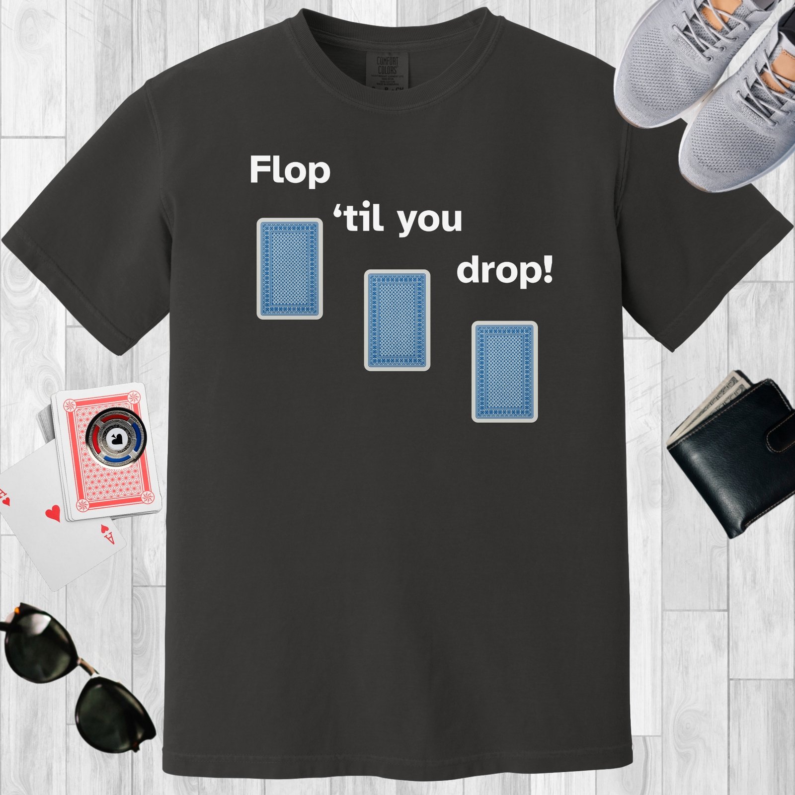 Graphite colored unisex crewneck poker-themed T-shirt. Design features the text 'Flop 'til you drop'. Image of 3 playing cards face down.