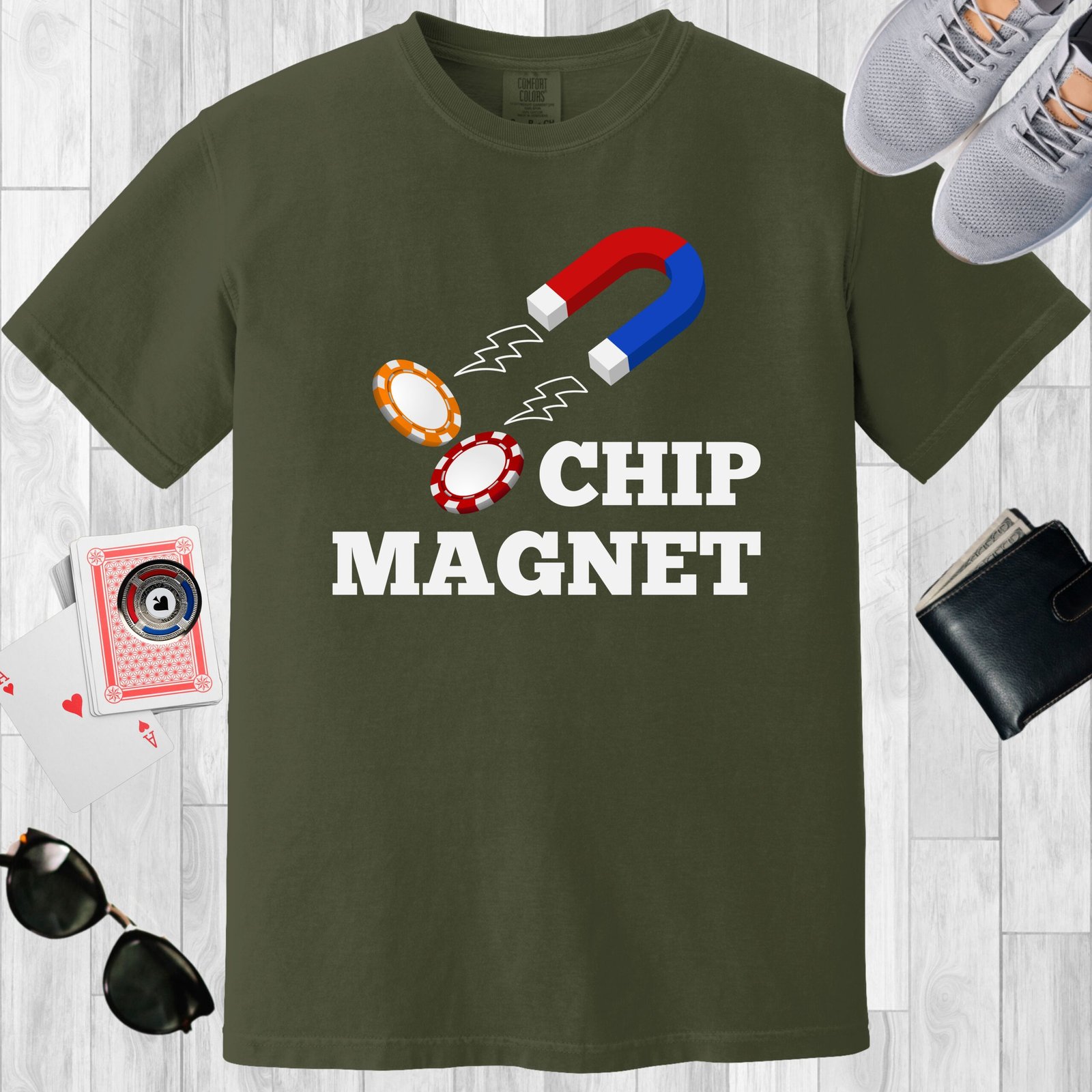Moss colored unisex crewneck poker-themed T-shirt. Design features the text 'Chip Magnet' Image of a magnet attracting poker chips.