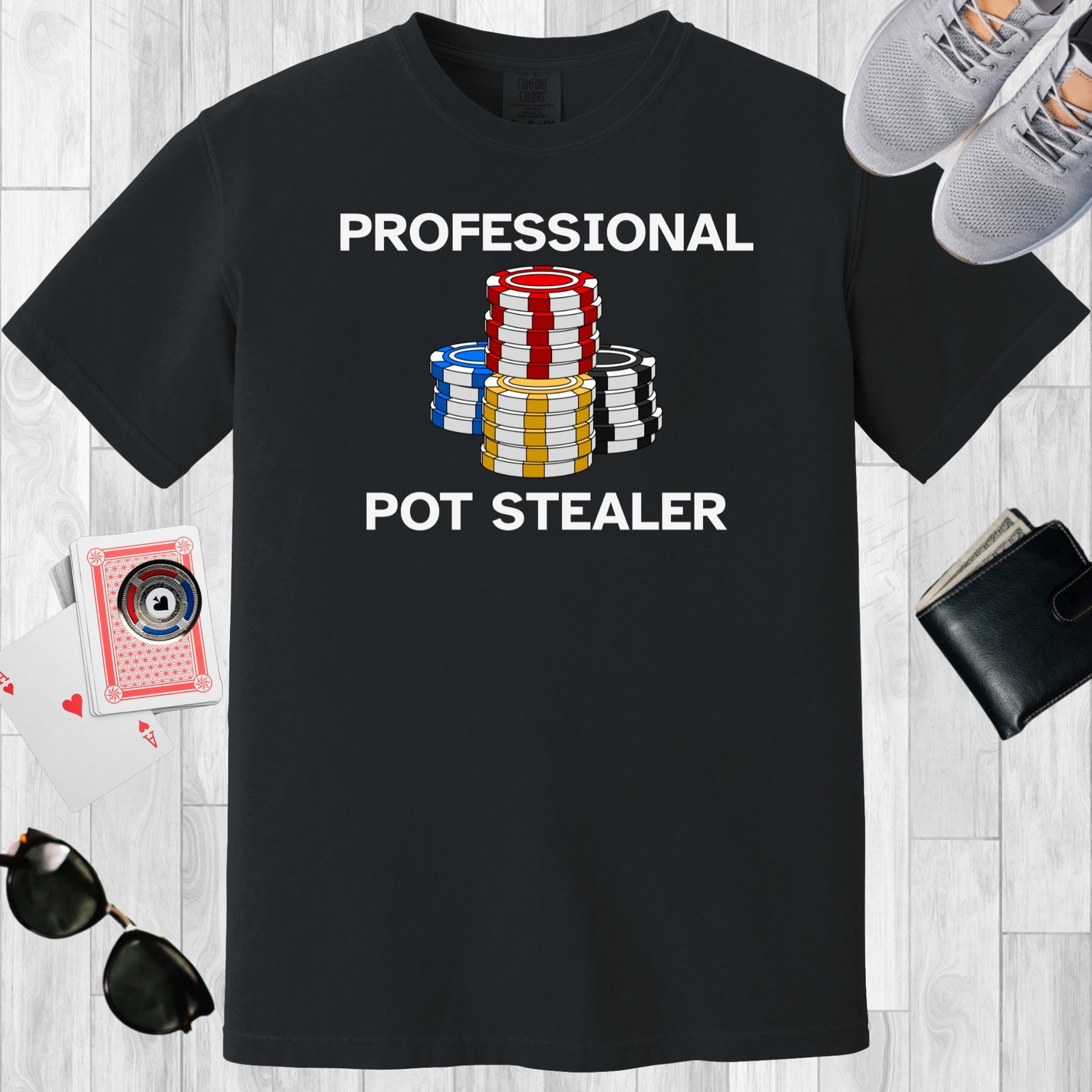 Black colored unisex crewneck poker-themed T-shirt. Design features the text 'Professional Pot Stealer'. Image of poker chip stacks.